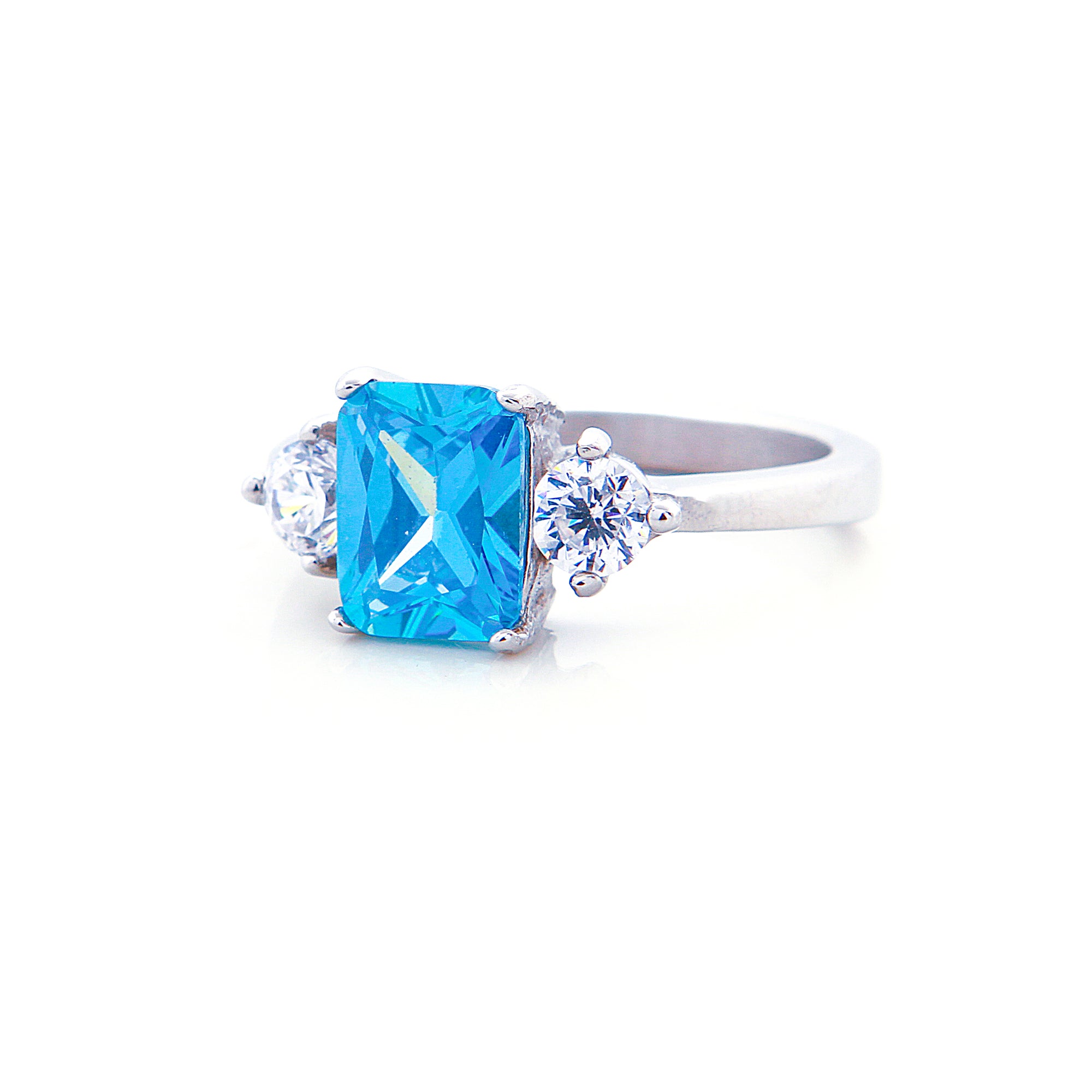 Three Stone Blue Topaz Engagement Ring