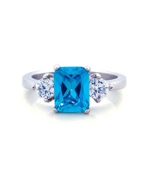 Three Stone Blue Topaz Engagement Ring